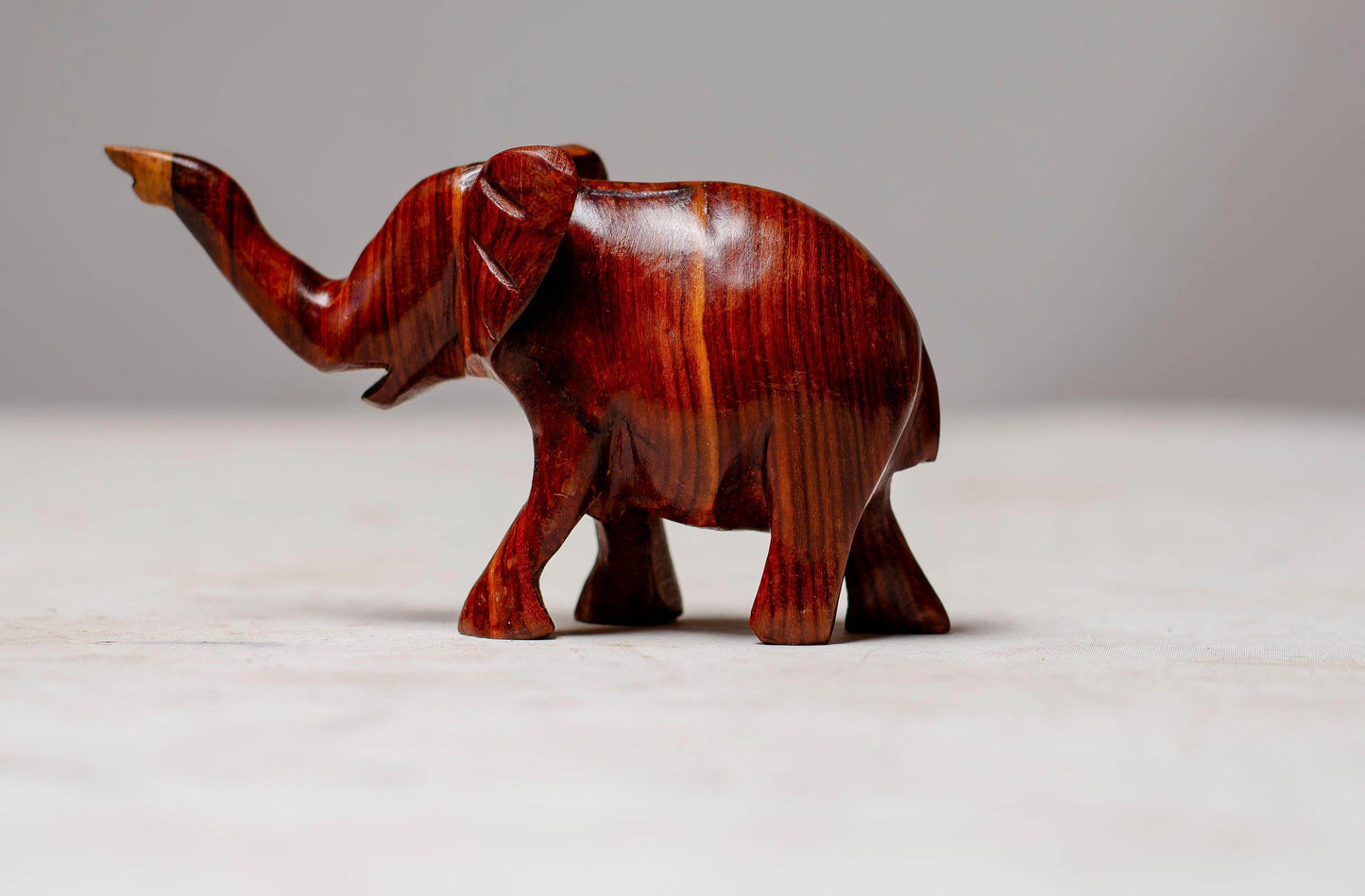 A BEAUTIFULLY HAND CARVED ELEPHANT FROM TEAK WOOD - PRODUCT PARADISE STORE