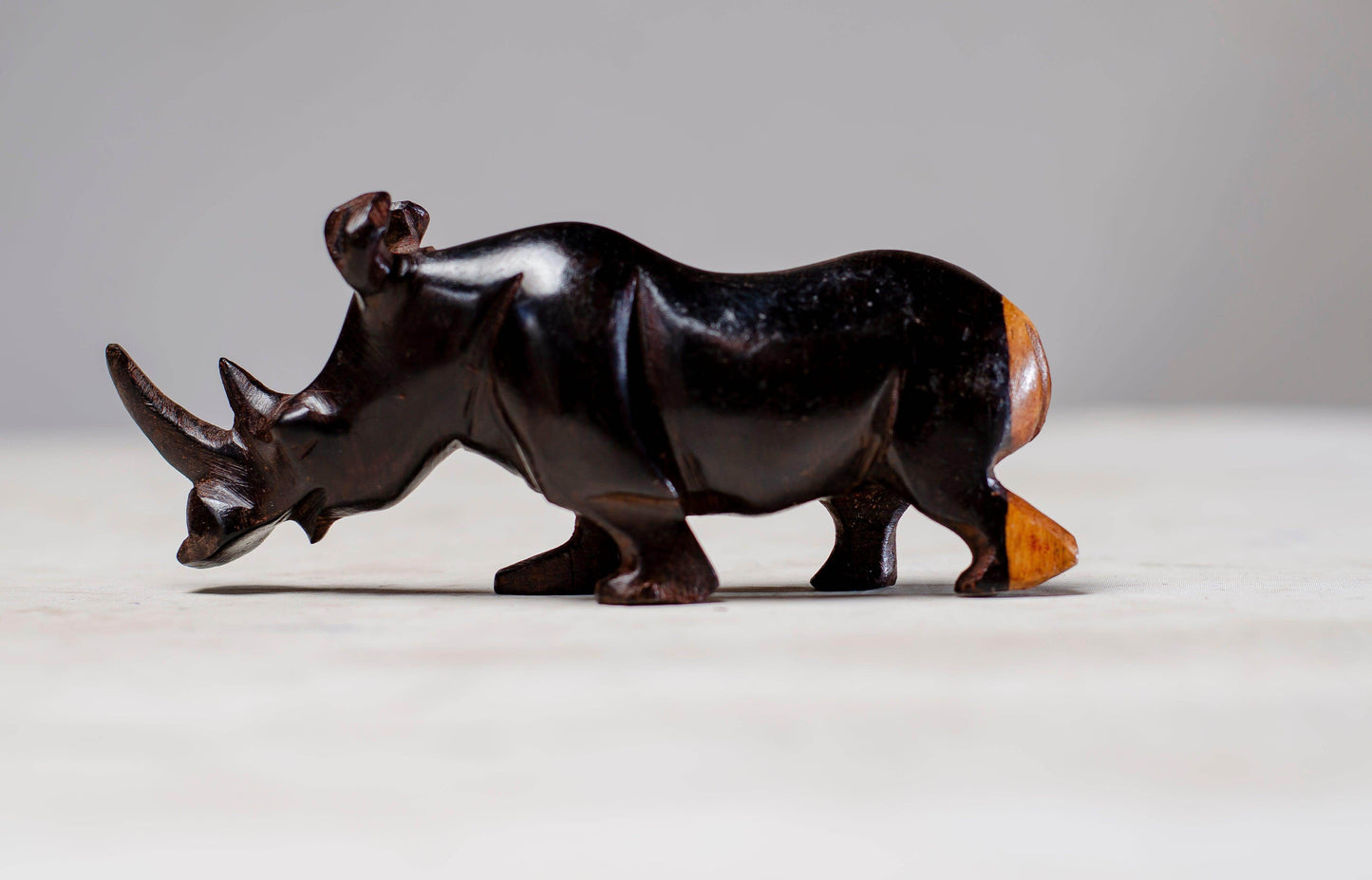 A BEAUTIFULLY HAND CARVED RHINO FROM EBONY WOOD - PRODUCT PARADISE STORE