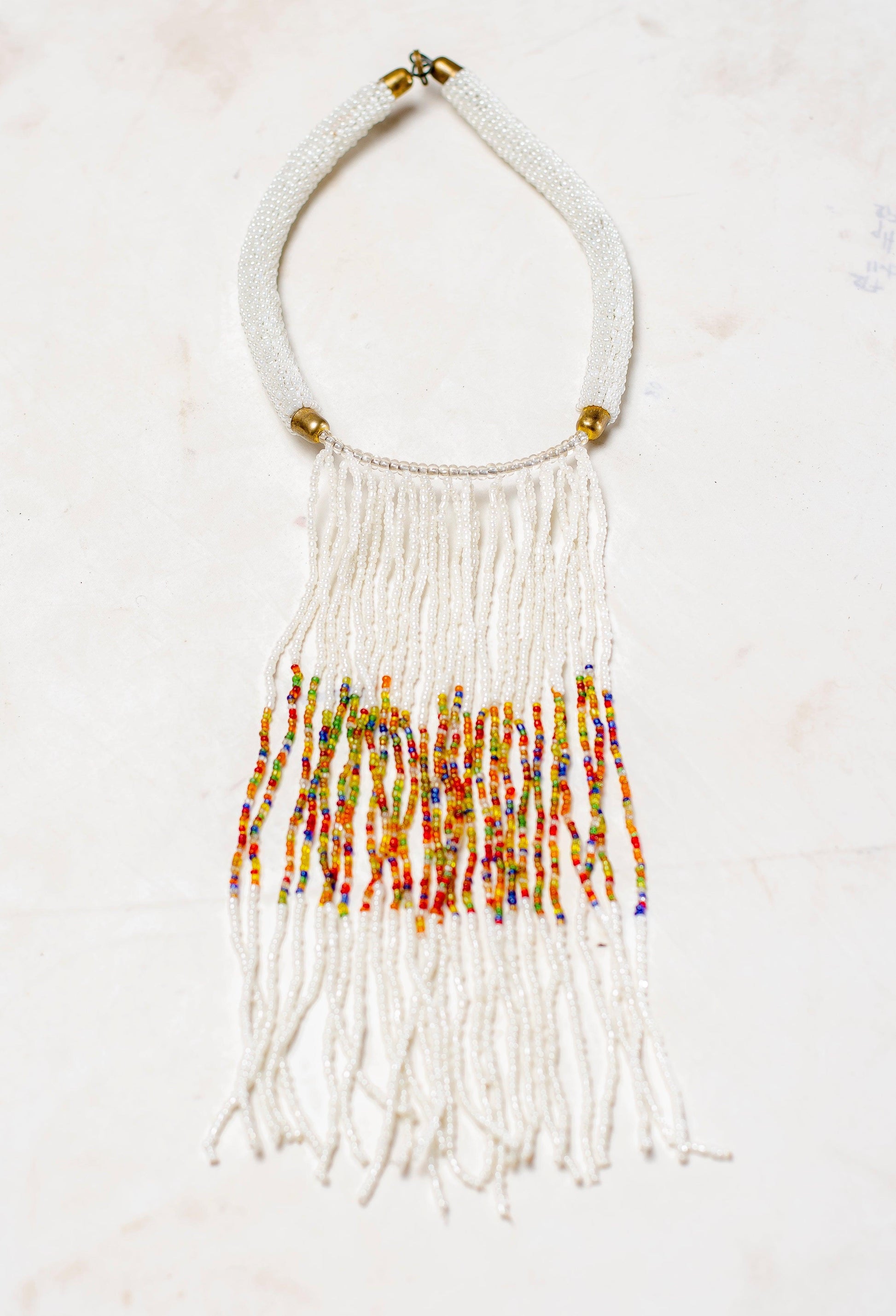 white tasseled beaded necklace